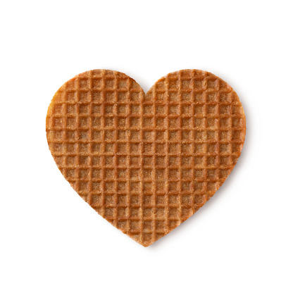 Traditional Dutch syrup waffle in the shape of a valentine heart close up isolated on white background