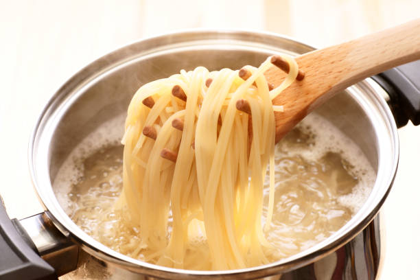 Boil the pasta Boil the pasta serving utensil stock pictures, royalty-free photos & images