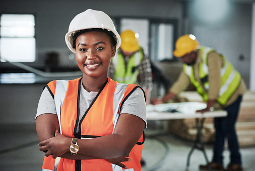 Portrait of a confident young woman working at a construction site