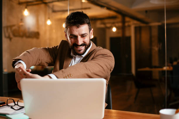 istock Young businessman working on laptop at office. 1297564518