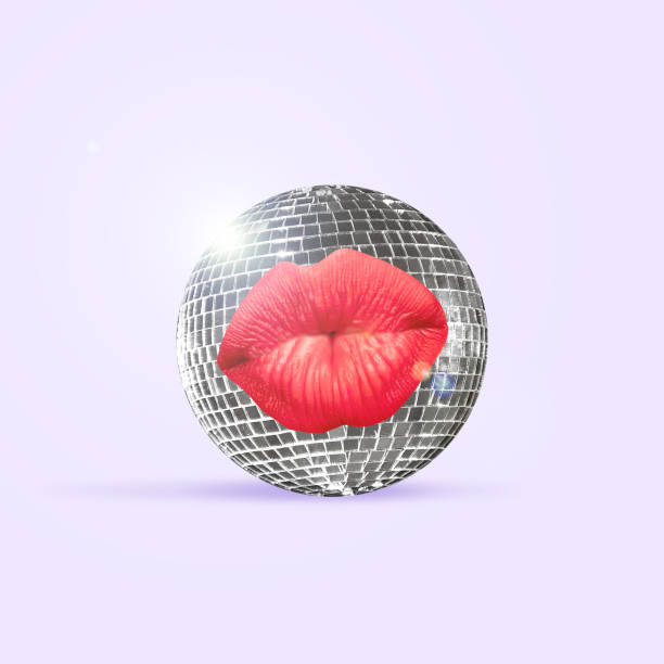 istock Contemporary art collage. Red female lips on disco ball isolated on background. 1297565553