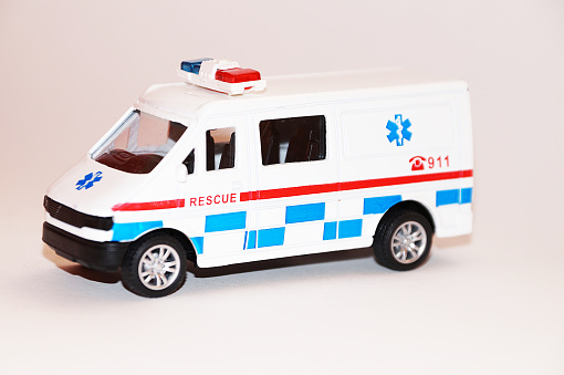 911 rescue toy car on white background, copy space.
