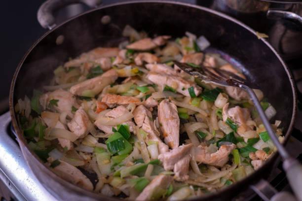 istock Cooking a chicken curry while stuck at home. 1297566957