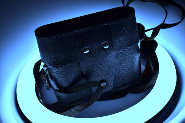 the camera case lies on the ring lamp