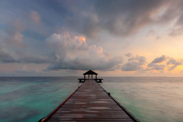 istock Maldives Pier Spectacular Sunrise 1297568215