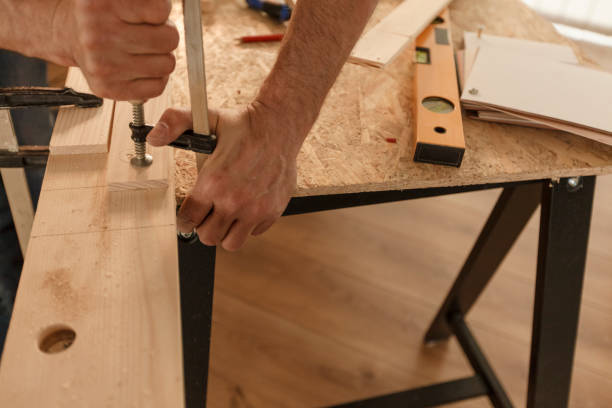 istock Clamping wooden planks together 1297569547