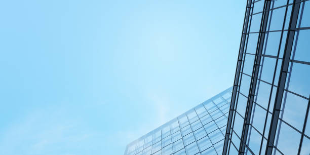 istock Low angle view of futuristic architecture, Skyscraper office building with cloud reflected on window, 3D rendering. 1297571843