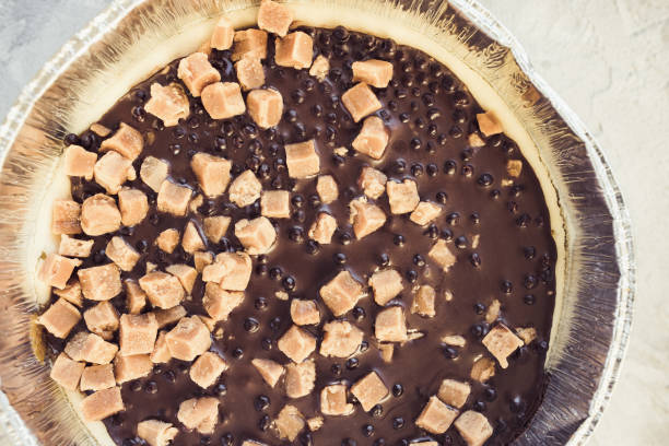 istock Cheesecake decorated with salted caramel pieces 1297573715