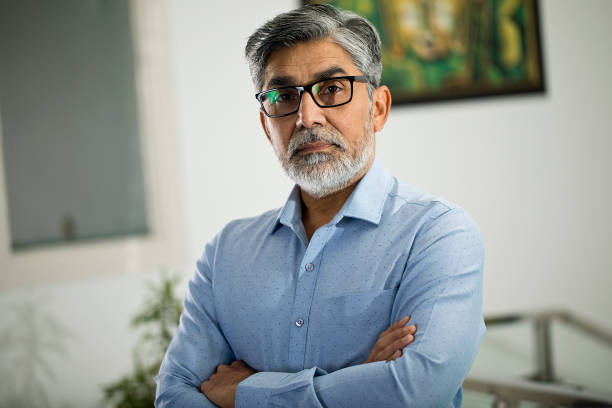 istock Confident businessman with arms crossed 1297574090