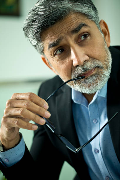 istock Thoughtful businessman looking away 1297576079