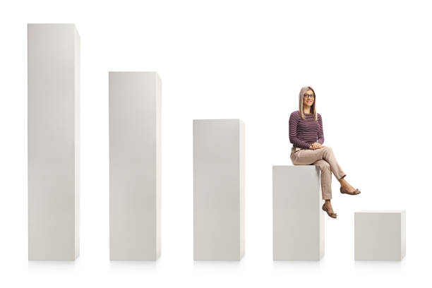 istock Young blond woman with glasses sitting on a white chart 1297576087