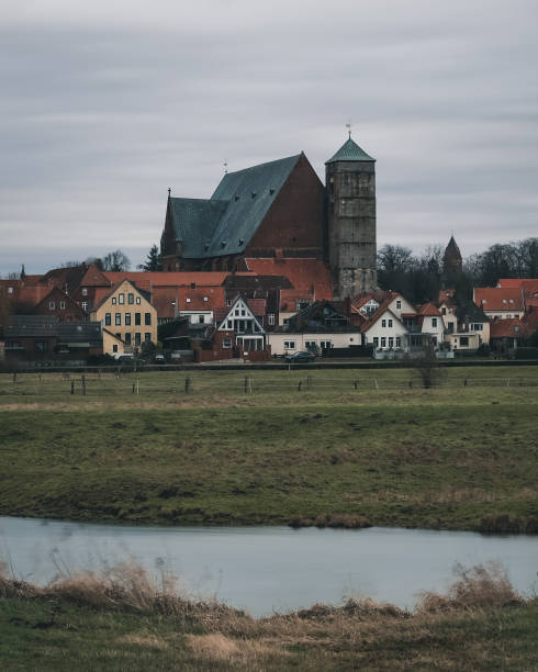 istock Cathedral on the river Aller in Verden 1297578152