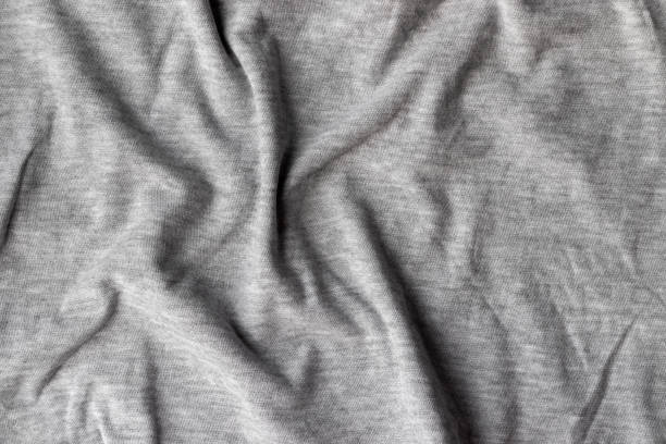 istock Cotton jersey fabric texture. Crumpled gray textile background 1297582943