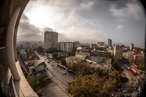 Cityscape view on sunny day from skyscraper terrace