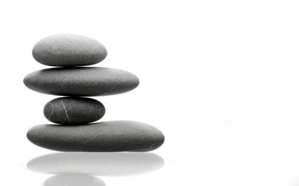istock Pile of 4 gray stones isolated on white 1297583796
