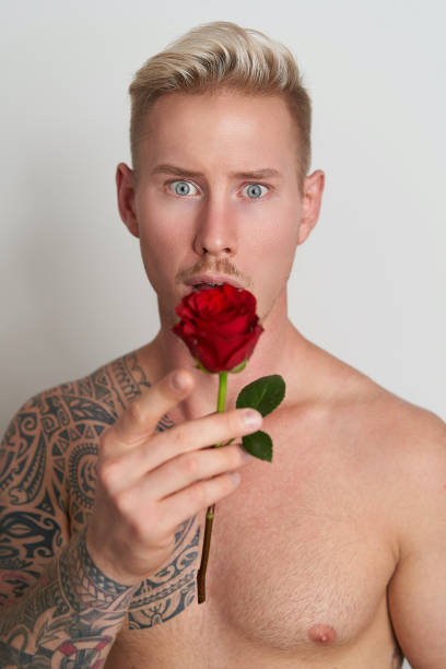istock Male lover looking surprised with a flower 1297583845