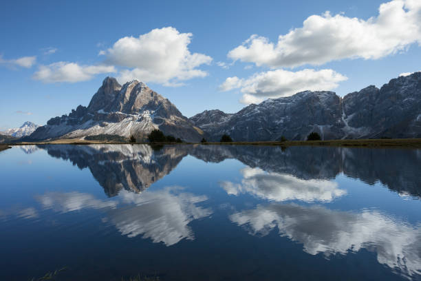 istock Sass de Putia reflects itself over a small alpine lake in Dolomites at evening 1297584832