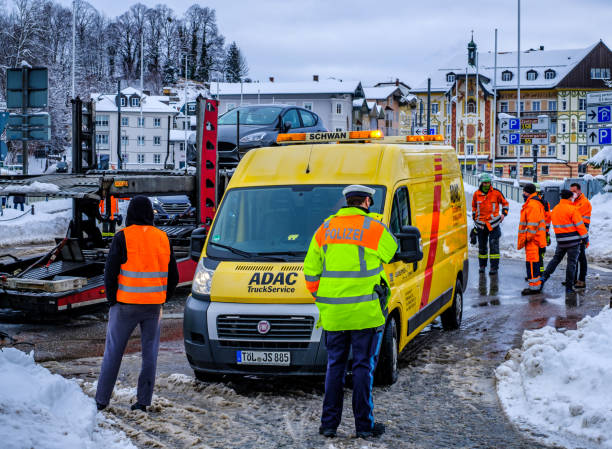 Firebrigade and Police in Germany Bad Tolz, Germany - January 18: people from thr firebrigade and police at a truck accident in Bad Tolz on January 18, 2020 adac stock pictures, royalty-free photos & images