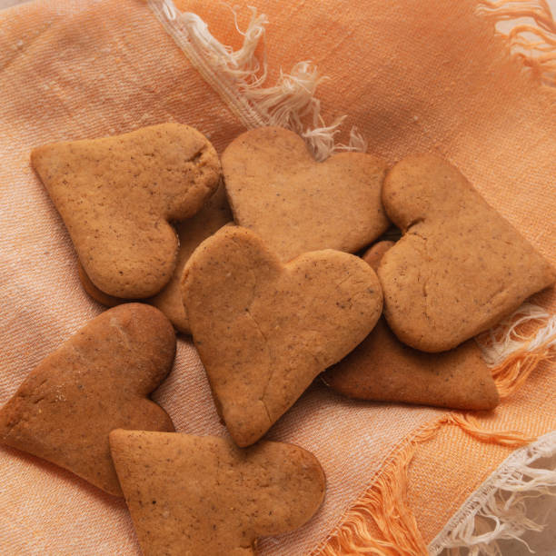 istock Heart shaped ginger craft cookie lies on a napkin 1297586423