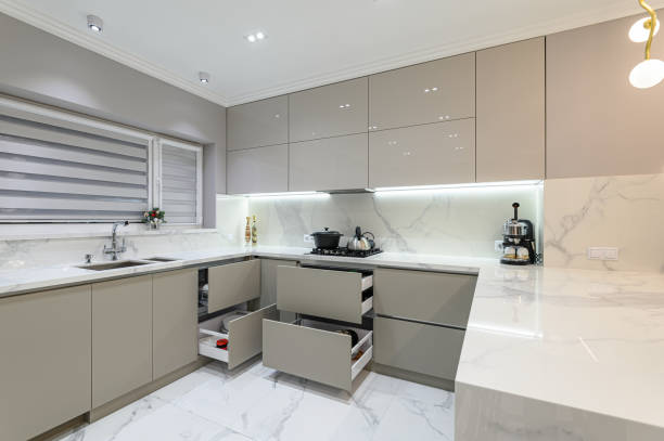 istock Open drawers at modern white kitchen furniture 1297586527