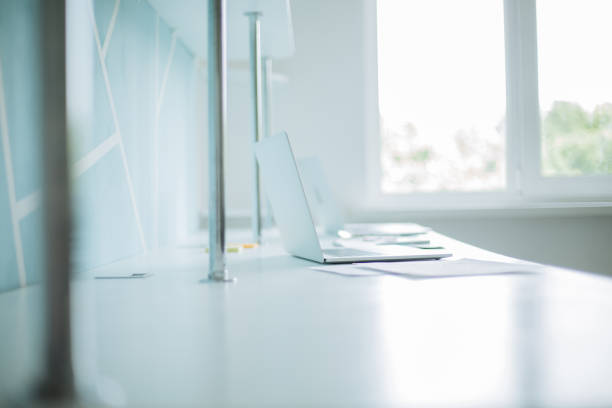 istock background image of a laptop and business documents on the office Desk 1297586529