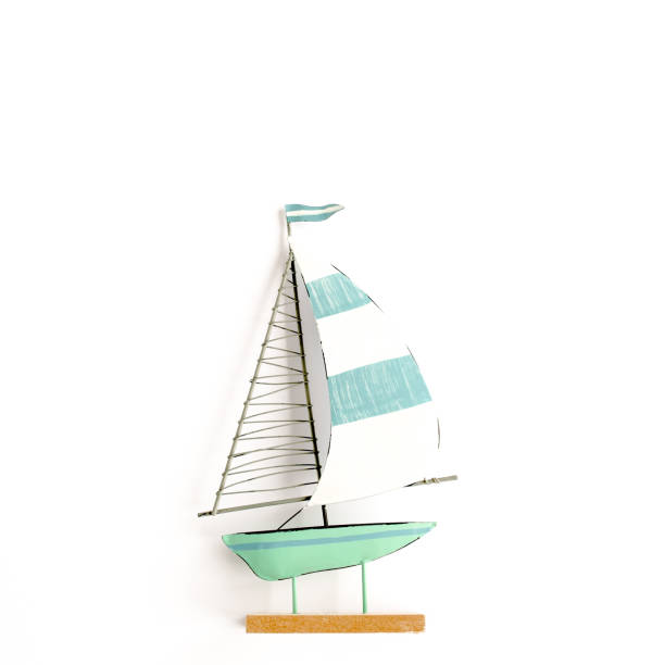 istock Miniature toy boat on white background. Flat lay, top view 1297588466