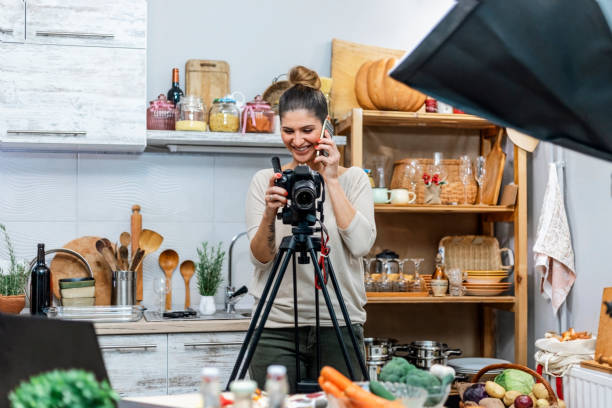istock Young woman in her kitchen creating a cooking vlog 1297589319