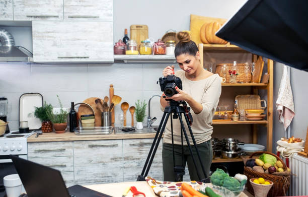 istock Young woman in her kitchen creating a cooking vlog 1297589439