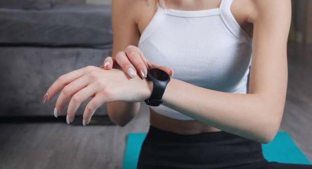 istock Woman using smart watch at home. 1297592725