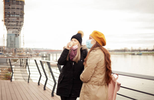 istock Two woman wearing protective mask 1297592831