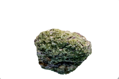 Olivine, closeup of the gemstone cut out on a white background