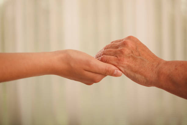 istock Holding hands as a sign of trust 1297593129