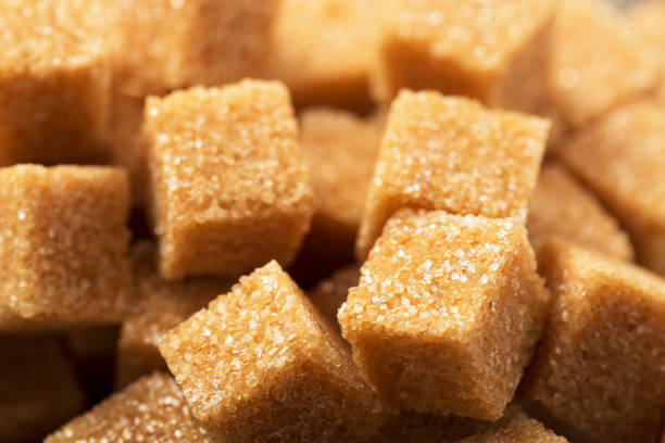 istock Pieces of brown sugar close-up macro, top view 1297594367