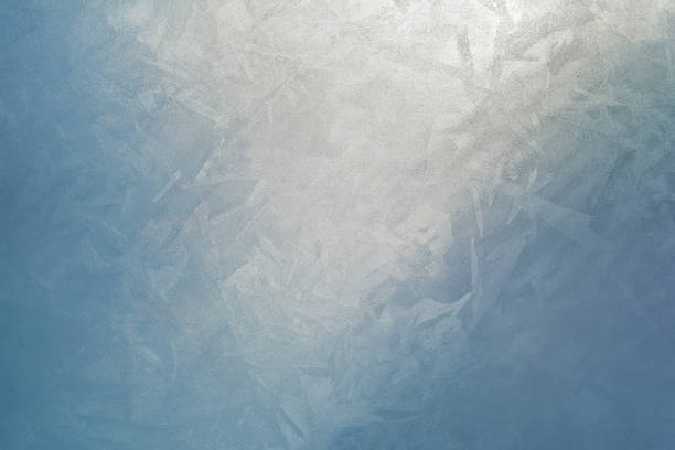 A person walks in the snow with a snowboard, great for winter sports or outdoor adventures.