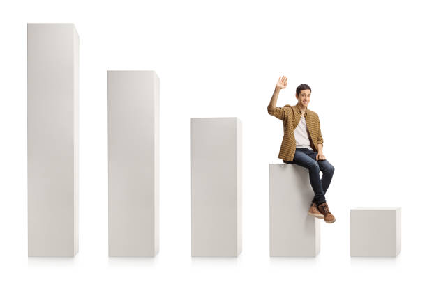istock Young casual man sitting on a chart graph and smiling 1297597576