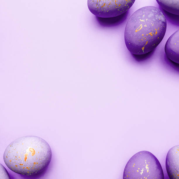 istock Easter frame of eggs painted in purple color. 1297597837