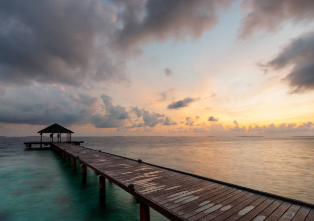 istock Maldives Pier Spectacular Sunrise 1297598976