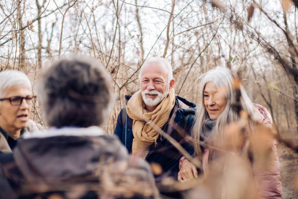 istock Group of seniors enjoying exploring the nature together 1297599077