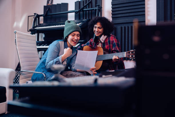 istock Two musicians recording their new song in the studio 1297599151