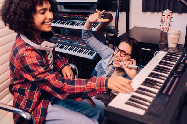 istock Two girls having a great time while recording a new song 1297599166