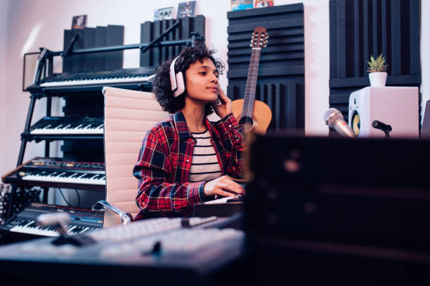 istock Young musician working in the music studio as a composer 1297599171