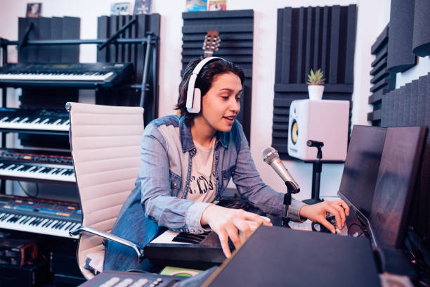 istock Young musician composing electronic music in the studio 1297599197
