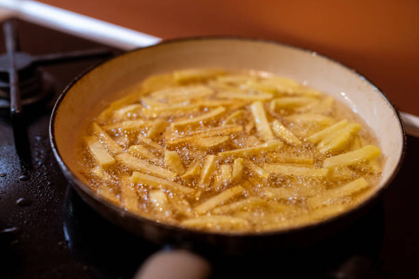 istock Frying potatos in vegetable oil 1297599335