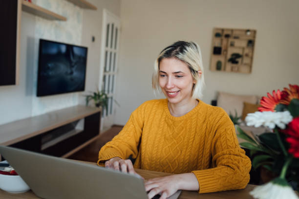 istock Young woman starting her working day at home office 1297599393