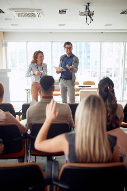 istock young caucasian manager lecturing at business seminar 1297599829
