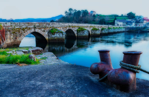 Medieval bridge and a bollard for mooring boats