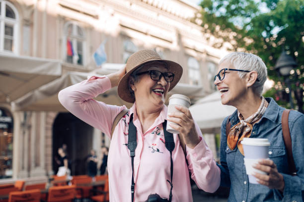 istock Two senior friends enjoying coffee and having a good time on their vacation 1297601091