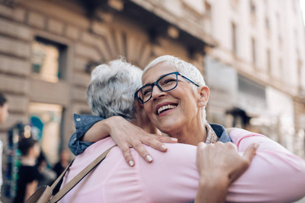 istock Two senior friends meeting at their vacation 1297601095