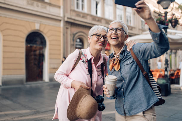istock Senior friends enjoying  their journey and taking a selfie 1297601103