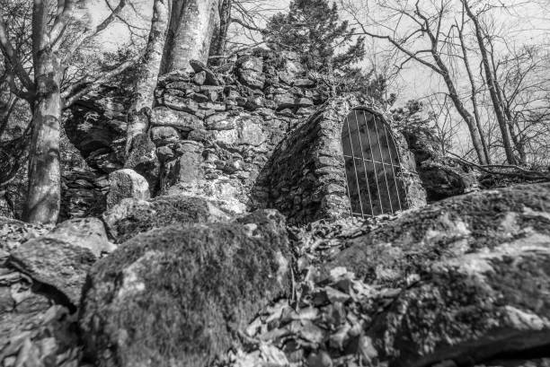 istock Black and White image Old stone built dilapidated monastery ruin on the Rusel and Ruselabsatz near Geisslinger Stein Koenigstein and Hausstein in the Bavarian Forest near Deggendorf and Regen, Germany 1297602060